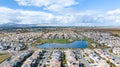 A drone view of a community in Oakley, California with a lake in the center