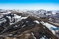 Drone view of dried-up riverbed in mountains. Yellow grass and big rocks. A steep gorge with an ascent to a mountain Royalty Free Stock Photo