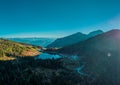 Drone view of Early morning on the lake of Pramollo, Italy, just close to Nassfeld in Austria. Beautiful mountain lake in clean