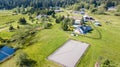 Drone view of farm house and green pastures