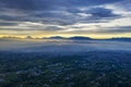 Drone view of foggy Puncak Pass in the morning Royalty Free Stock Photo