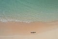 Drone view of girl and her shadow on beach Royalty Free Stock Photo