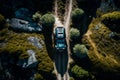 A Drone view of a Jeep climbing a mountain. AI Royalty Free Stock Photo