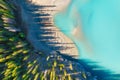 Drone view of the lake and forest in the glacier valley. View of the moraines. Landscape from the air. River on a moraine. Landsc