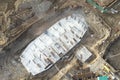 Drone view of a large construction site. Out of focus, possible granularity, motion blur. Sharpening noise, or film grain that