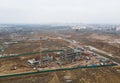 Drone view of a large construction site. Tower cranes in action on fog background. Housing renovation concept. Crane during Royalty Free Stock Photo