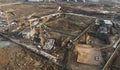 Drone view of a large construction site. Tower cranes in action on fog background. Housing renovation concept. Crane during Royalty Free Stock Photo