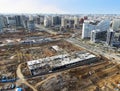 Drone view of a large construction site. Tower cranes in action on fog background. Housing renovation concept. Crane during Royalty Free Stock Photo