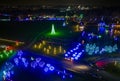 Drone View of Large Drive Thru Christmas Display, With Lots of Colored Lights, Trees, and Landscapes