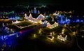 Drone View of Large Drive Thru Christmas Display, With Lots of Colored Lights, Trees, and Landscapes