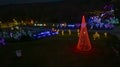 Drone View of Large Drive Thru Christmas Display, With Lots of Colored Lights, Trees, and Landscapes