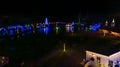 Drone View of Large Drive Thru Christmas Display, With Lots of Colored Lights, Trees, and Landscapes