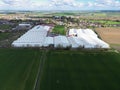 Drone view of a large logistics and distribution warehouse seen nestled in the East Anglian countryside. Royalty Free Stock Photo