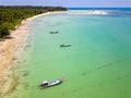 Drone view of longtail boats moored off a tropical sandy beach in Khao Lak, Thailand Royalty Free Stock Photo