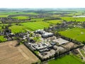 Drone view of a modern community NHS hospital showing the various modern buildings and tall antenna system.