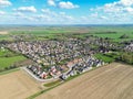 Drone view of a new housing estate showing detached bungalows in a rural location in Cambridgeshire, UK.