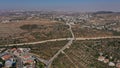 Aerial footage over Israeli Jewsih Settlement Har hadar and Arab Palestinian Village Royalty Free Stock Photo