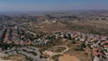 Aerial footage over Israeli Jewsih Settlement Har hadar and Arab Palestinian Village Royalty Free Stock Photo