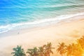 Drone view of a person running along the beach in the morning, beautiful sea waves, summer sunset seascape Royalty Free Stock Photo