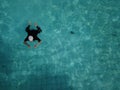 Drone view of a person swimming