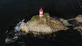 Drone view of the picturesque old Basargin lighthouse on the coast of the sea