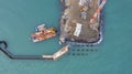 Drone view of a pier construction and piles. Working piers were built for the handling of passengers and cargo onto and off ships