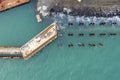Drone view of a pier construction and piles. Working piers were built for the handling of passengers and cargo onto and off ships