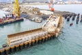 Drone view of a pier construction and piles. Working piers were built for the handling of passengers and cargo onto and off ships