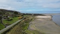 Drone view of the Poppit Sands Beach under a blue cloudy sky in Wales