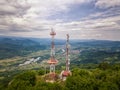 Drone view of river Drina near Ljubovija and a cellphone tower on top of a mountain