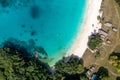 Drone view of sandy beach and green shore near turquoise sea. Tourist settlement. Sanma, Vanuatu