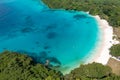 Drone view of sandy beach and green shore near turquoise sea. Tourist settlement. Sanma, Vanuatu