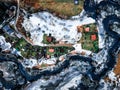 drone view of a small village during a winter flood, showcasing the destruction and devastation of nature