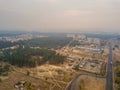Drone view of smoke floats over the small town