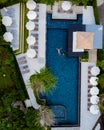 drone view at swimpool with men and woman couple in pool, view from above at swimming pool Royalty Free Stock Photo