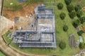 Drone view top down of steel roof construction,construction workers to roofing metal frame