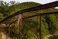 Drone view of torn USA flag on Jenkinsburg Bridge over Cheat River