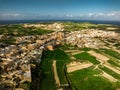 Drone view unveils the architectural beauty of Gozo an intricate tapestry of historic structures against the Mediterranean