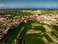 Drone view unveils the architectural beauty of Gozo an intricate tapestry of historic structures against the Mediterranean