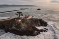 Drone view of waves crashing against rocks at Battery Point Lighthouse Royalty Free Stock Photo