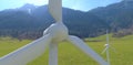 A drone view of a wind turbine installed in the forested mountains of the eastern Alps. Clean renewable energy available even at