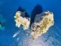 Drone viewpoint over Faraglioni, Capri, Italy. Overhead view of famous landmark in summer season Royalty Free Stock Photo