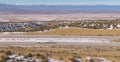 DRONE: White lorry hauls cargo down scenic freeway running across snowy desert