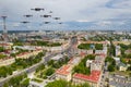 Drones fly over a residential city. Urban landscape with drones flying over it, quadrocopters Royalty Free Stock Photo