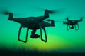 Silhouette of two drones in the sky Royalty Free Stock Photo