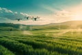 Drones hover over a field of crops, spraying them with precision under the bright sunlight, exemplifying the integration