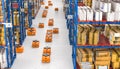 Drones moving inside a modern warehouse full of goods