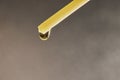 A drop of aromatic oil drips from the incense stick of the diffuser. Royalty Free Stock Photo