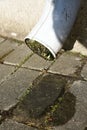 A drop of clean rain water flows down a old drainpipe sunny weather after rain