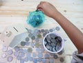 Drop coins in a piggy bank around a house and a glass of coins Royalty Free Stock Photo